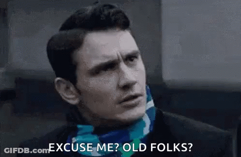 Man In Suit And Scarf Saying Excuse Me Old Folks GIF