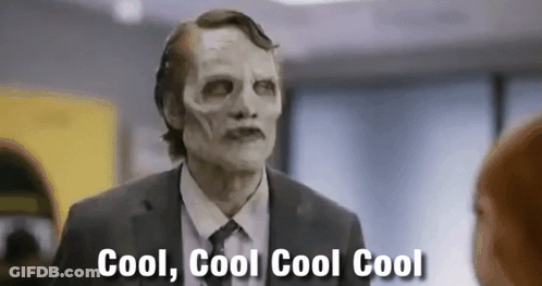 Man In Suit And Skeleton Mask Talking GIF