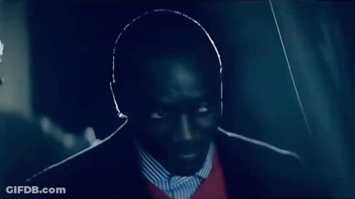 Man In Suit And Striped Shirt Looking GIF