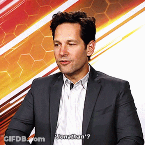 Man In Suit And Striped Shirt Says Jonathan's GIF