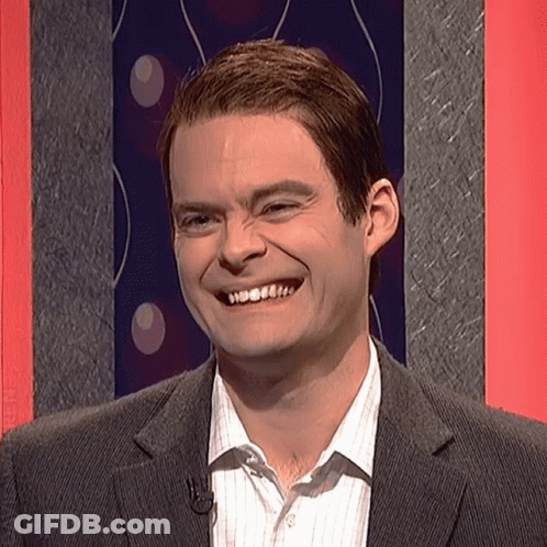 Man In Suit And Striped Shirt Smiling With Microphone GIF