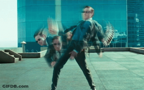 Man In Suit And Sunglasses Dancing On Rooftop GIF