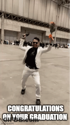 Man In Suit And Sunglasses Holding Flowers GIF