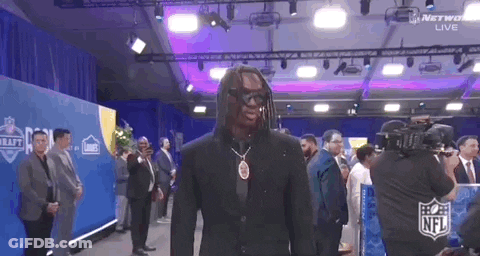 Man In Suit And Sunglasses In Front Of Crowd GIF