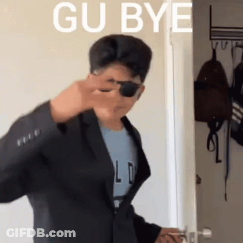 Man In Suit And Sunglasses In Front Of Gu Bye Door GIF