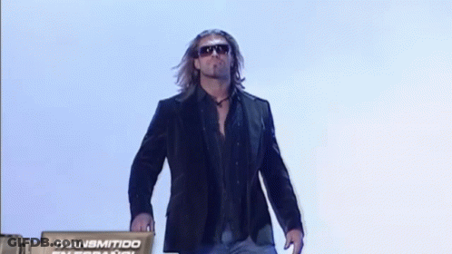 Man In Suit And Sunglasses In Front Of Transmitido International Sign GIF