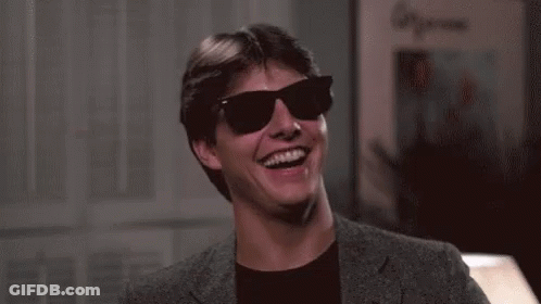 Man In Suit And Sunglasses Laughing And Smiling GIF