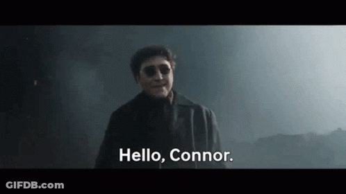 Man In Suit And Sunglasses Saying Hello Connor GIF