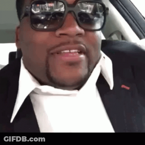 Man In Suit And Sunglasses Smiling GIF