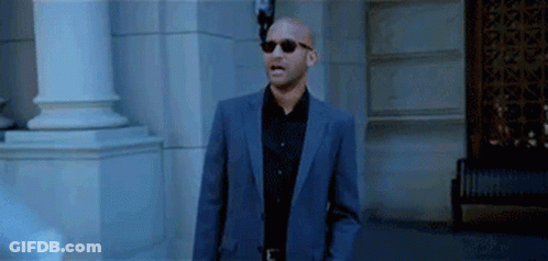 Man In Suit And Sunglasses Standing GIF