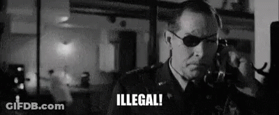 Man In Suit And Sunglasses Talking On Cell Phone Saying Illegal GIF