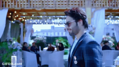 Man In Suit And Sunglasses With People GIF