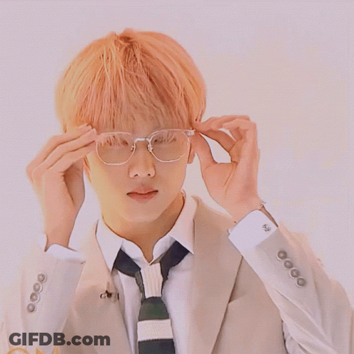 Man In Suit And Tie Adjusting Glasses GIF