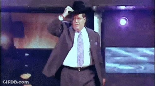 Man In Suit And Tie Adjusting Hat GIF