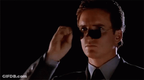 Man In Suit And Tie Adjusting Sunglasses GIF