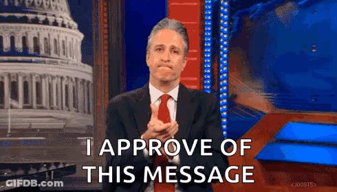 Man In Suit And Tie Applauding In Front Of Building GIF