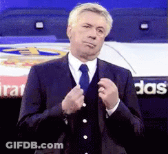 Man In Suit And Tie At Adidas Sign GIF