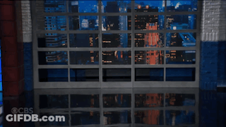 Man In Suit And Tie At CBS Logo GIF