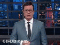 Man In Suit And Tie At City Window GIF