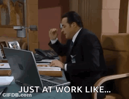 Man In Suit And Tie At Desk GIF