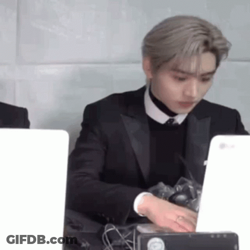 Man In Suit And Tie At Desk With Laptop GIF