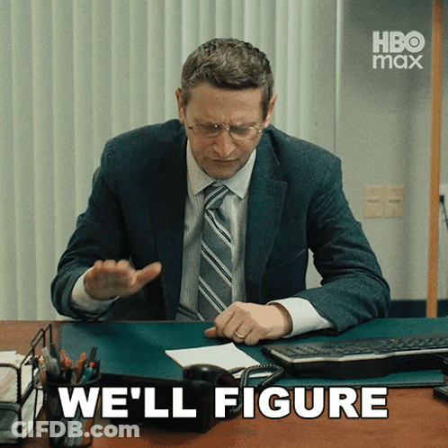 Man In Suit And Tie At Desk GIF
