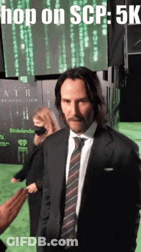 Man In Suit And Tie At Hop On SCP Sign GIF