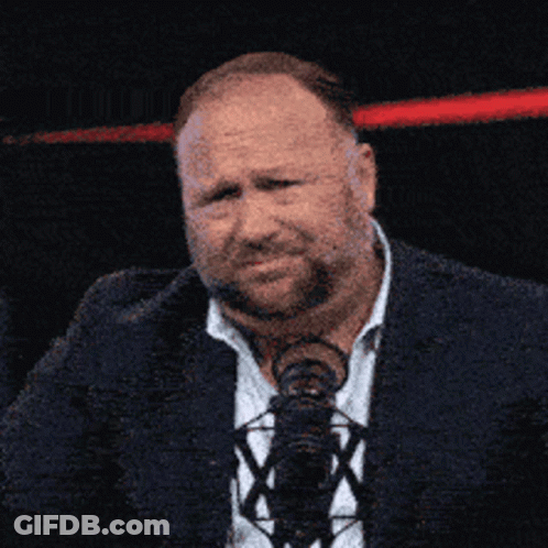 Man In Suit And Tie At M Microphone GIF