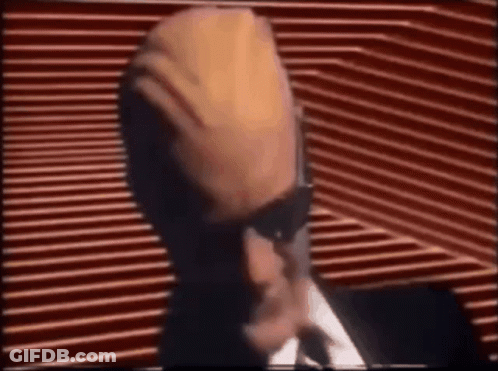 Man In Suit And Tie At Microphone GIF