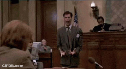 Man In Suit And Tie At Microphone GIF
