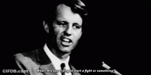 Man In Suit And Tie At Microphone GIF