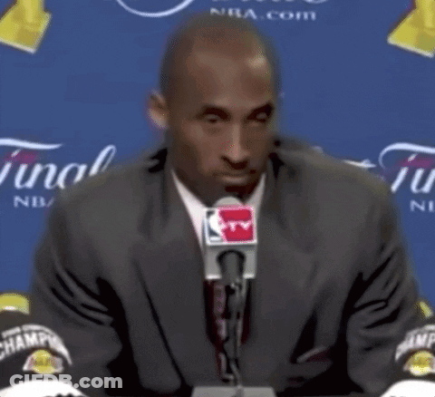 Man In Suit And Tie At Microphone GIF