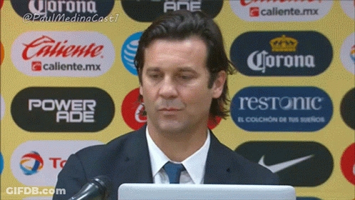 Man In Suit And Tie At Microphone GIF