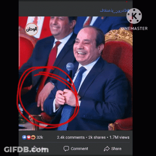 Man In Suit And Tie At Microphone Hand Circled Red GIF