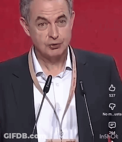 Man In Suit And Tie At Microphone GIF