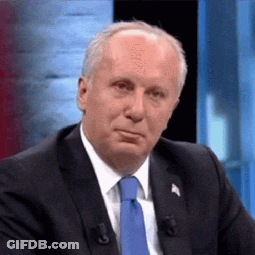 Man In Suit And Tie At Microphone GIF