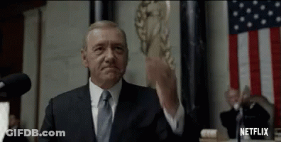 Man In Suit And Tie At Microphone GIF