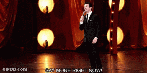 Man In Suit And Tie At Microphone GIF