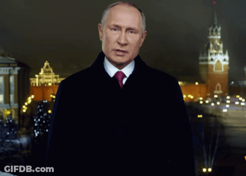 Man In Suit And Tie At Night Clock Tower GIF