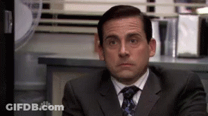 Man In Suit And Tie At Office Desk GIF