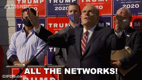 Man In Suit And Tie At Podium GIF