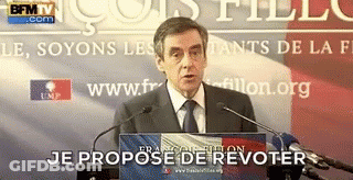 Man In Suit And Tie At Podium Je Propose De Revoter GIF