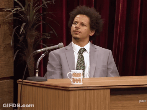 Man In Suit And Tie At Podium With Adult Cup GIF
