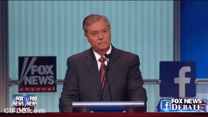 Man In Suit And Tie At Podium With Fox News Sign GIF