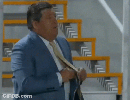 Man In Suit And Tie At Stairs GIF
