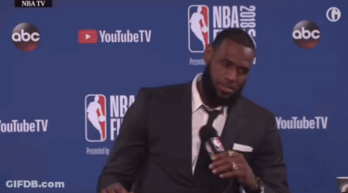 Man In Suit And Tie At Table With NBA Finals GIF