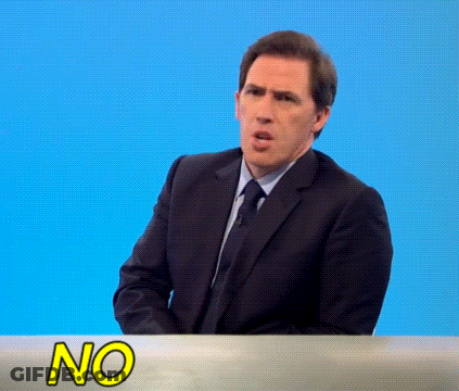 Man In Suit And Tie At Table With No Sign GIF