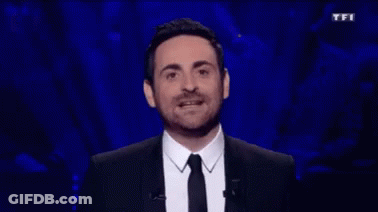 Man In Suit And Tie At TFI Sign GIF
