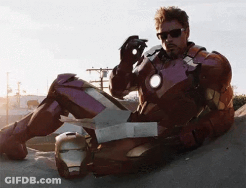 Man In Suit And Tie Before Avengers Sign GIF