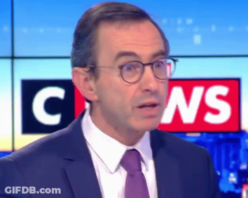 Man In Suit And Tie Before C News Sign GIF